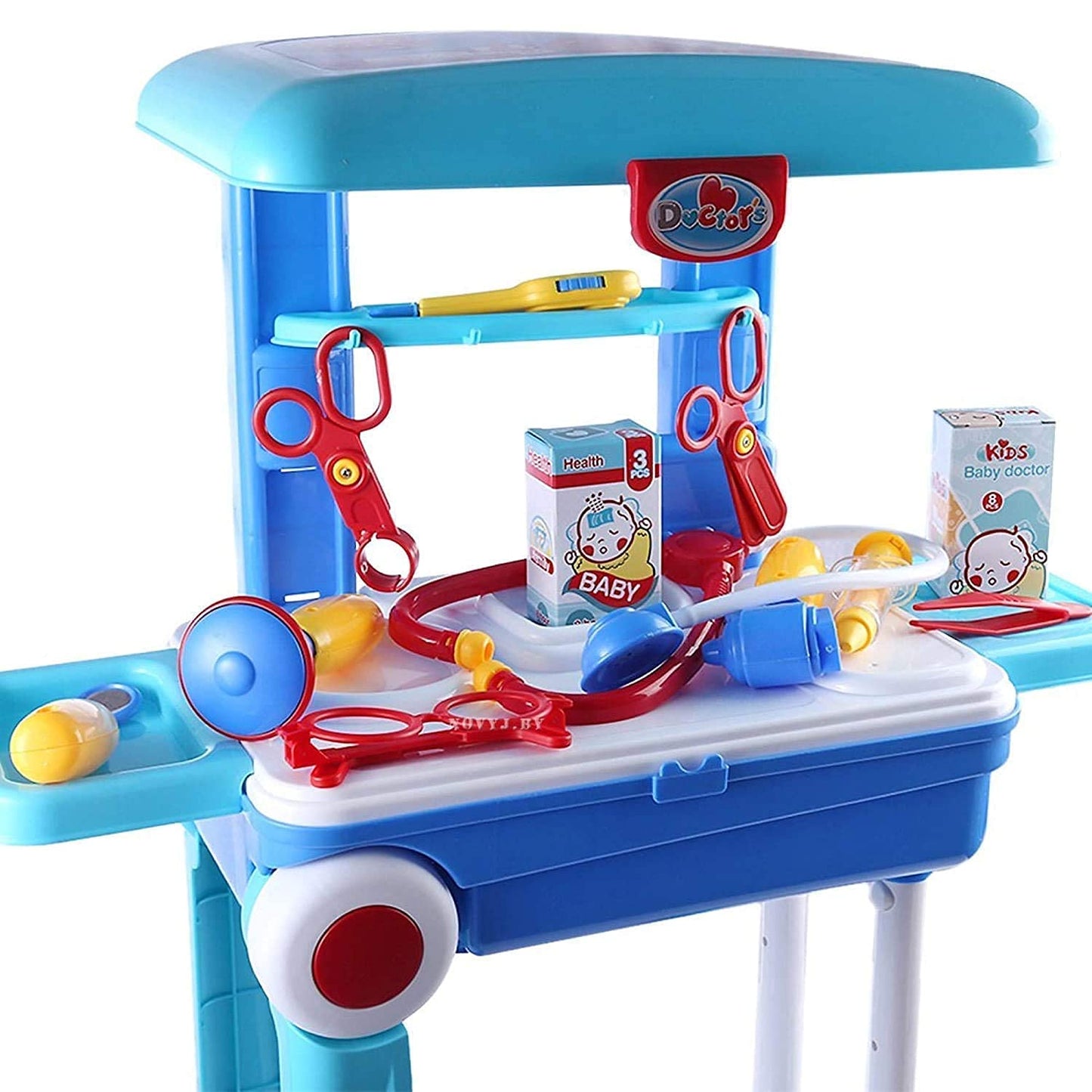 Toy doctor's desk with medical tools and a baby toy on a white background